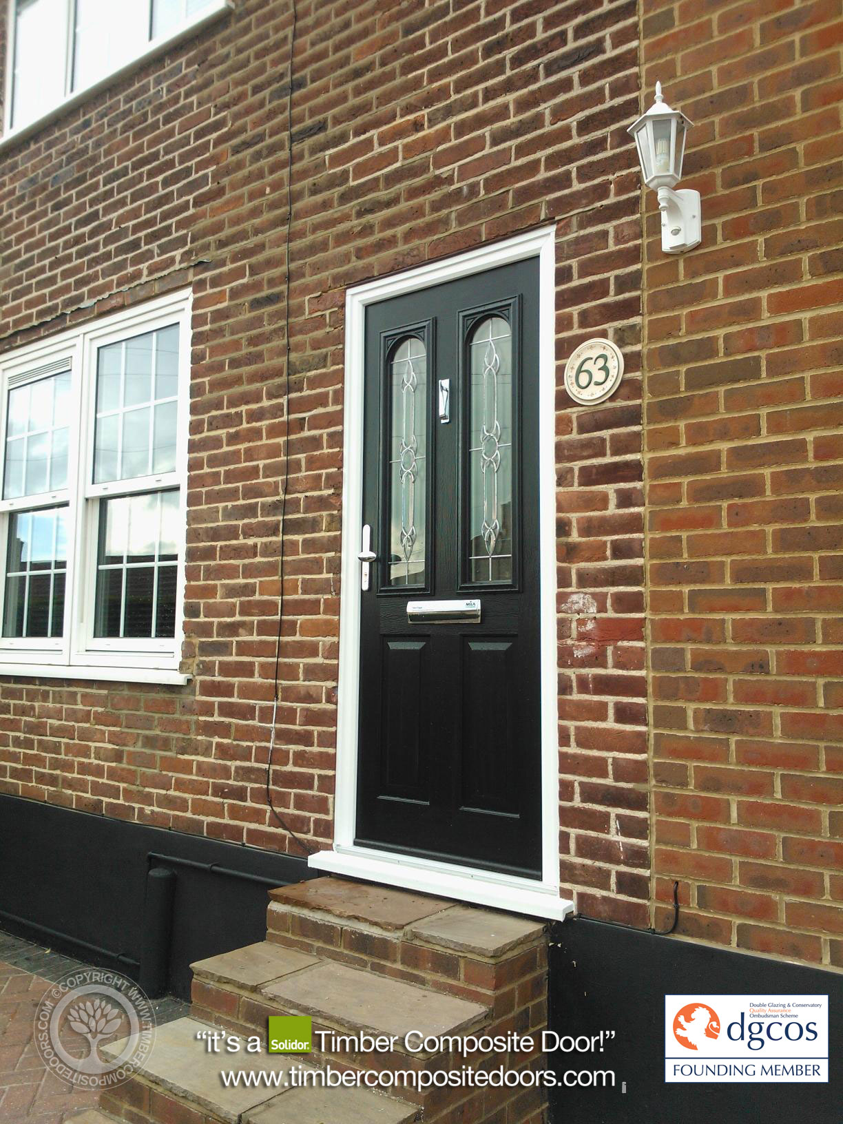 Solidor Nottingham composite door in black with classic panelled design and minimalist glazing, creating a premium, traditional entrance.