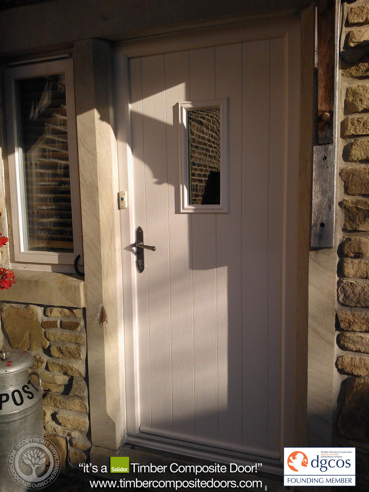 The Solidor Flint 2 composite door pairs a rustic, cottage-style vertical plank design with twin vertical glazing cassettes for an elegant, light-filled entrance