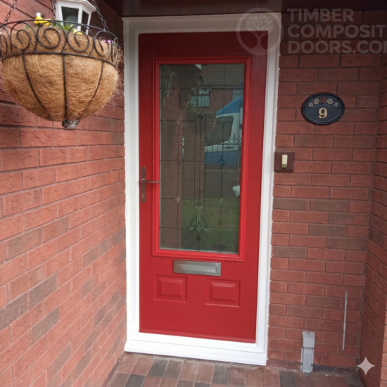 The Solidor Alnwick: A commanding traditional entrance featuring a large top glazed unit and the signature 48mm solid timber core.